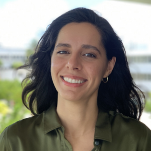 Headshot photo of Dr. Ana Tarano. She wears a dark olive green dress shirt.